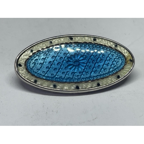 702 - A SILVER AND ENAMEL BROOCH IN A PRESENTATION BOX