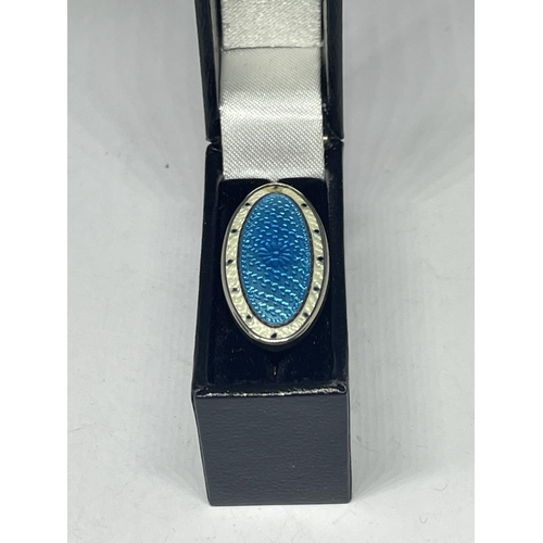 702 - A SILVER AND ENAMEL BROOCH IN A PRESENTATION BOX