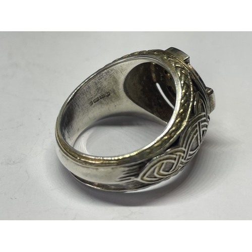 715 - AN ORNATE SILVER RING