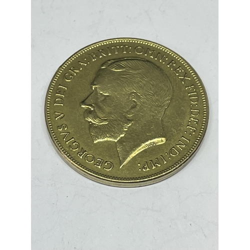 723 - A YELLOW METAL COIN