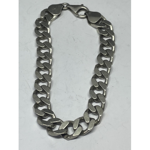 728 - A HEAVY SILVER BRACELET