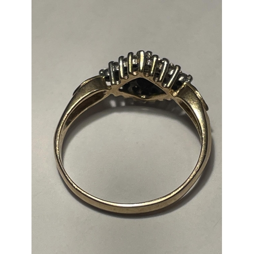 607 - A 9 CARAT GOLD RING WITH A CENTRE DIAMOND SIZE N/O