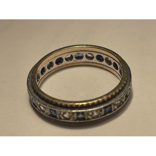 609 - A 9 CARAT GOLD RING WITH A BAND OF SAPPHIRES AND CUBIC ZIRCONIA STONES