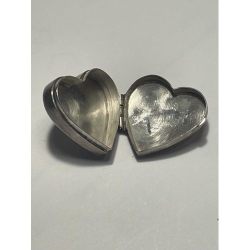 611 - A MARKED SILVER HEART SHAPED PILL BOX