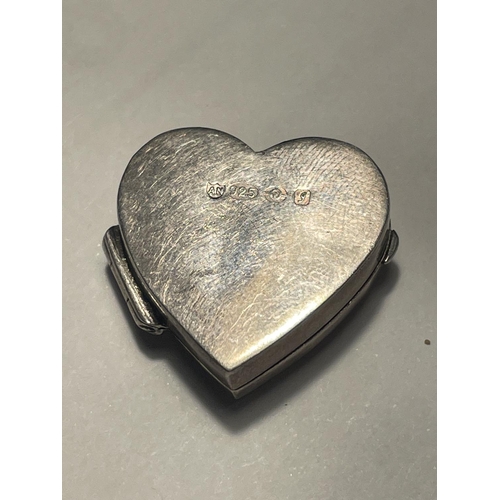 611 - A MARKED SILVER HEART SHAPED PILL BOX