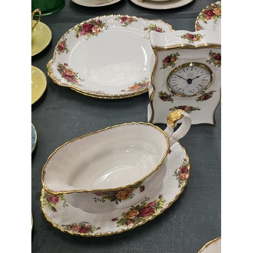 63 - A QUANTITY OF ROYAL ALBERT 'OLD COUNTRY ROSES' TO INCLUDE A CLOCK, CAKE PLATES, SIDE PLATES, SAUCE B... 