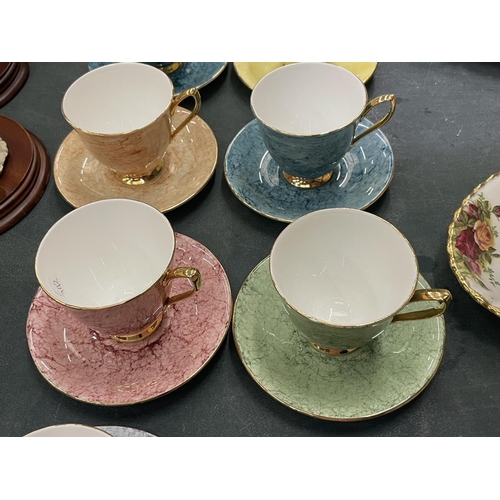 64 - A QUANTITY OF ROYAL ALBERT 'GOSSAMER' CUPS AND SAUCERS IN DIFFERENT COLOURS ( 10 IN TOTAL )