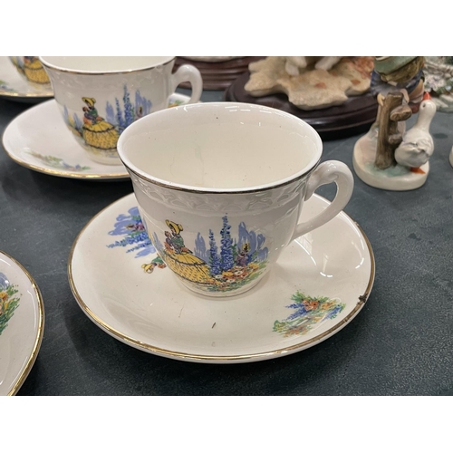 66 - SIX VINTAGE CUPS AND SAUCERS WITH CRINOLINE DECORATION