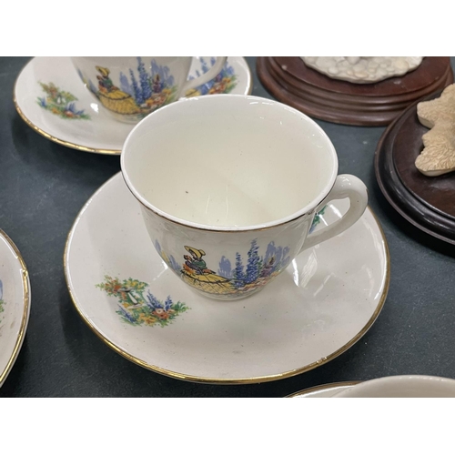 66 - SIX VINTAGE CUPS AND SAUCERS WITH CRINOLINE DECORATION