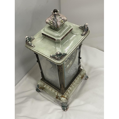 67 - AN ANTIQUE MANTLE CLOCK WITH BEVELLED GLASS CASE WITH GLASS FRAME, PALE CERAMIC FOOTED BASE AND TOP ... 