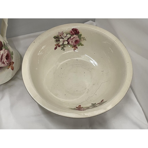 74 - A LARGE TOILET JUG AND BOWL WITH FLORAL DECORATION