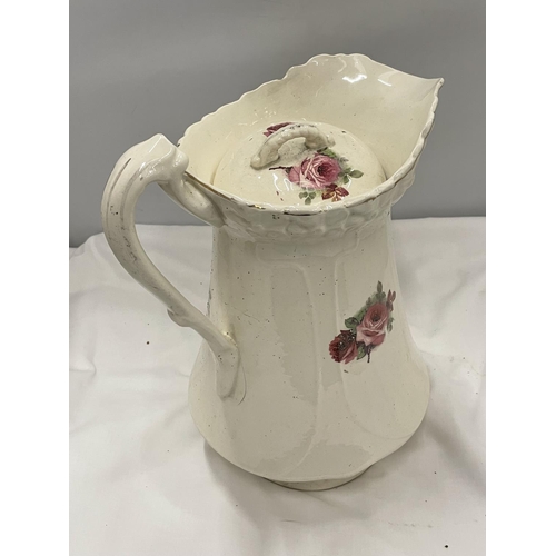 74 - A LARGE TOILET JUG AND BOWL WITH FLORAL DECORATION