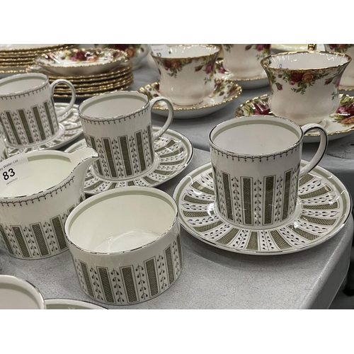 83 - A SUSIE COOPER 'PERSIA' COFFEE SET TO INCLUDE A COFFEE POT, CUPS, SAUCERS, SIDE PLATES, CREAM JUGS A... 