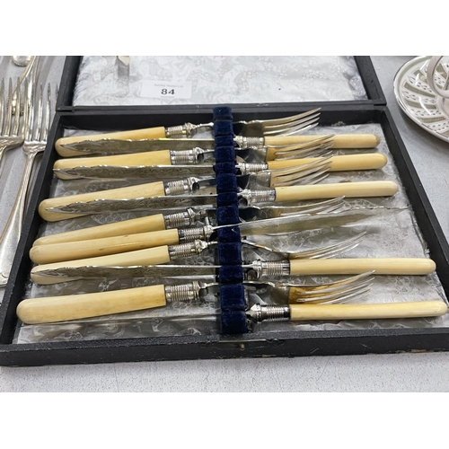 84 - ALARGE QUANTITY OF VINTAGE FLATWARE TO INCLUDE BOXED ARTS AND CRAFTS STYLE CAKE FORKS, KNIVES, FORKS... 