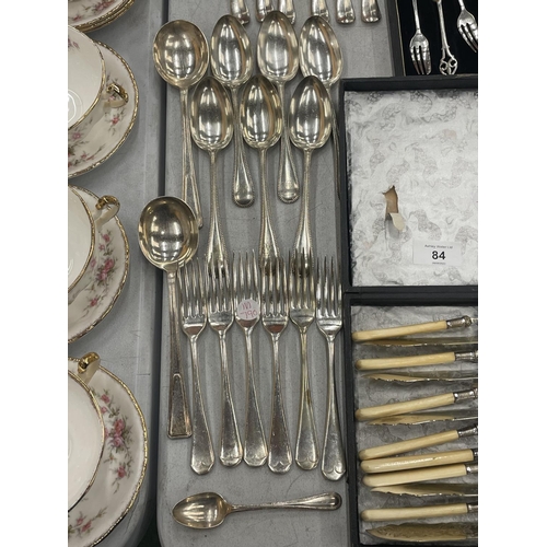 84 - ALARGE QUANTITY OF VINTAGE FLATWARE TO INCLUDE BOXED ARTS AND CRAFTS STYLE CAKE FORKS, KNIVES, FORKS... 