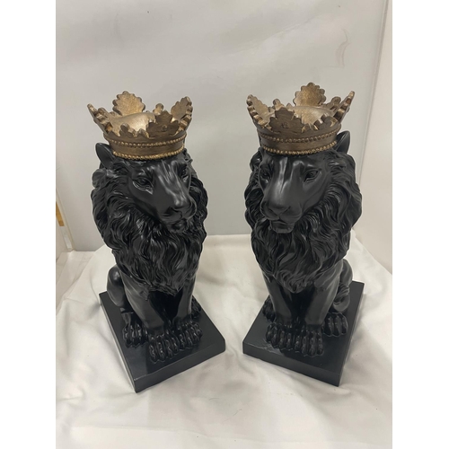 89 - A LARGE PAIR OF DECORATIVE BLACK LIONS WITH GOLD CROWNS HEIGHT 36CM