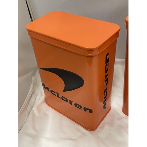 99 - TWO ORANGE McCLAREN STORAGE TINS