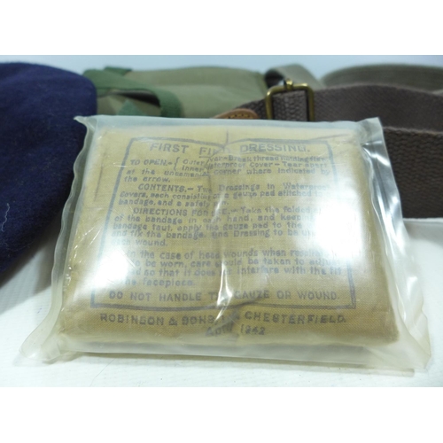 432 - A 1951 MILITARY BERET, FIELD DRESSING BAG AND BELTS