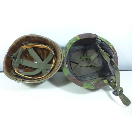 433 - A USA PAINTED METAL HELMET AND LINER AND A CAMOUFLAGE COVERED HELMET