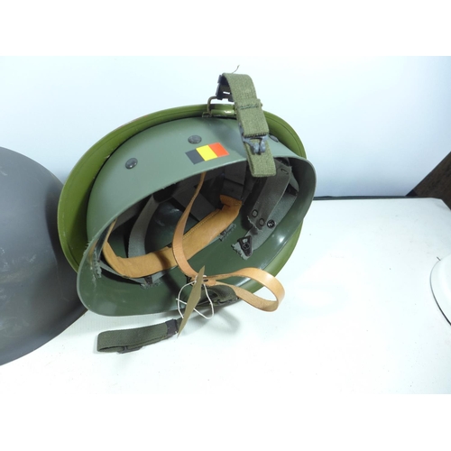 435 - A GERMAN HELMET AND LINER AND A GREY PAINTED METAL HELMET