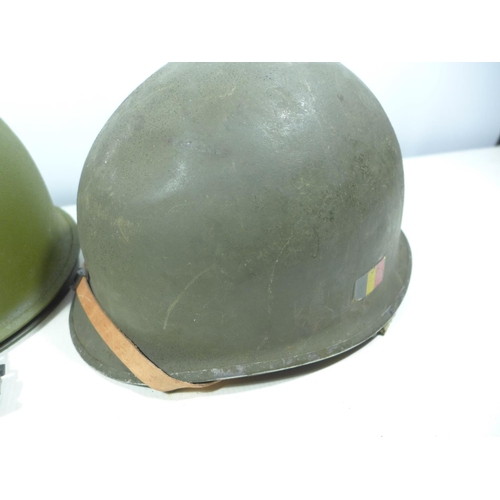 436 - A GERMAN HELMET AND LINER AND A FURTHER METAL HELMET