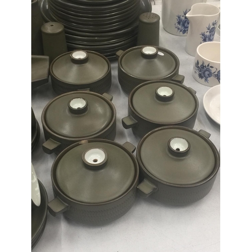 134 - A LARGE QUANTITY OF DENBY STONEWARE TO INCLUDE SERVING DISHES, VARIOUS SIZES OF PLATES, COFFEE AND T... 