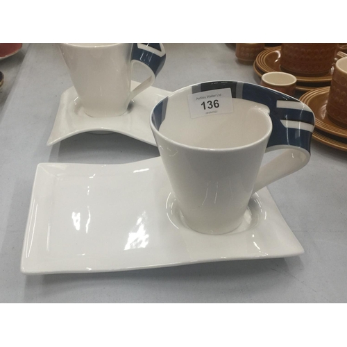 136 - A PAIR OF VILLEROY AND BOCH MODERNIST WAVE CUPS AND SAUCERS WITH BLUE PATTERNING