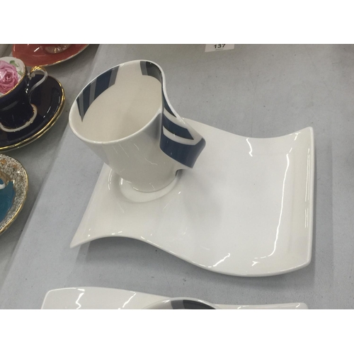 136 - A PAIR OF VILLEROY AND BOCH MODERNIST WAVE CUPS AND SAUCERS WITH BLUE PATTERNING