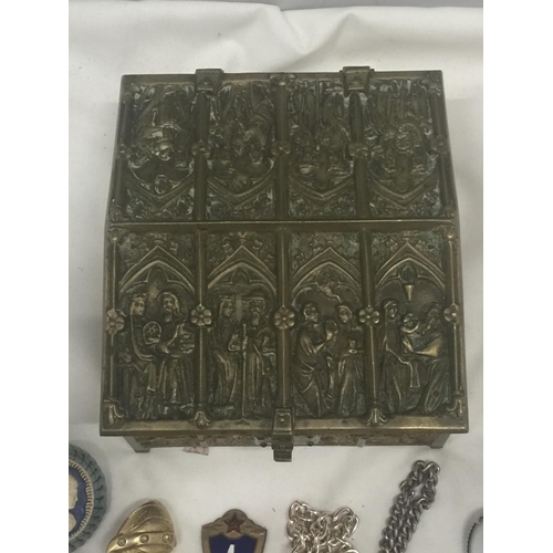 145 - A HEAVY BRASS JEWELLERY BOX EMBOSSED WITH ECCLESIASTICAL IMAGES AND VELVET LINING CONTAINING A QUANT... 