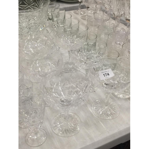 174 - A LARGE QUANTITY OF GLASSWARE TO INCLUDE BOWLS, COCKTAIL, SHERRY, PORT, WINE, TUMBLERS, CERAMICS, ET... 