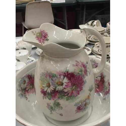 196 - A VINTAGE FLORAL CERAMIC BATHROOM SET TO INCLUDE A CHAMBER POT, WASH BOWL AND WASH JUG