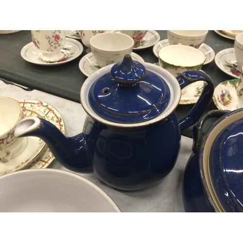 207 - A DENBY DINNER SERVICE IN BLUE TO INCLUDE PLATES, BOWLS, TEAPOTS, SERVING TUREEN, MILK JUGS, SUGAR B... 