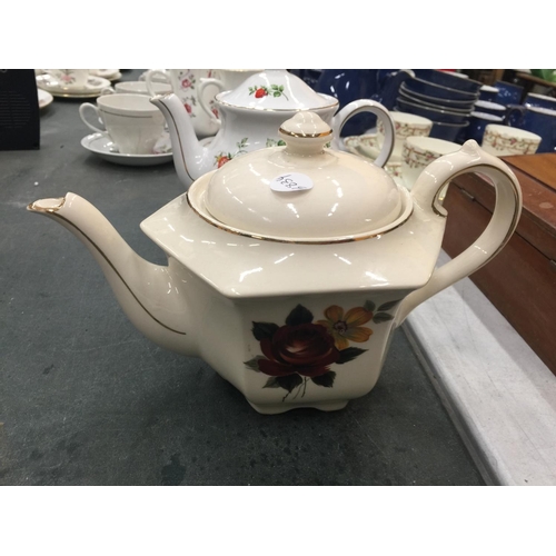 213 - FOUR COLLECTABLE TEAPOTS TO INCLUDE SADLER STRAWBERRY, SADLER HEXAGON SHAPE, ETC