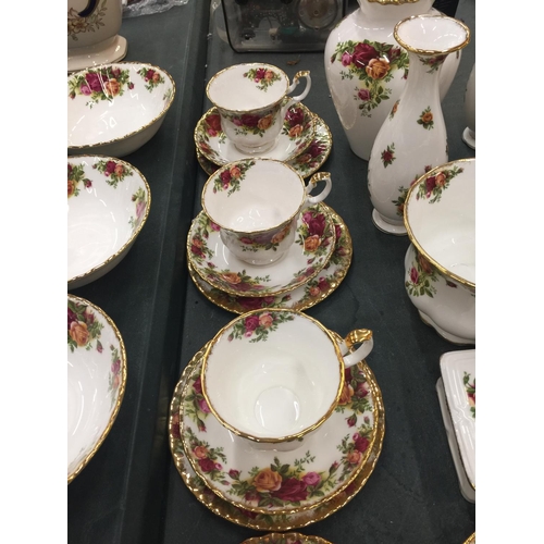 214 - A LARGE QUANTITY OF ROYAL ALBERT 'OLD COUNTRY ROSES' TO INCLUDE DINNER PLATES, SERVING PLATE, BOWLS,... 