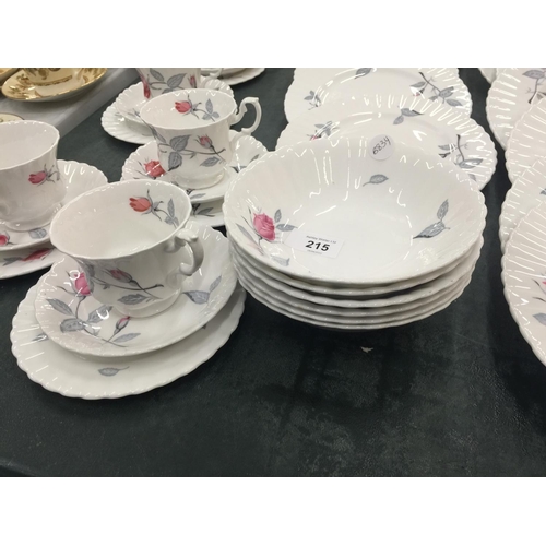 215 - A QUANTITY OF ROYAL ALBERT 'TRENTSIDE ROSE' CHINA TO INCLUDE A SERVING PLATE, DINNER PLATES, SIDE PL... 