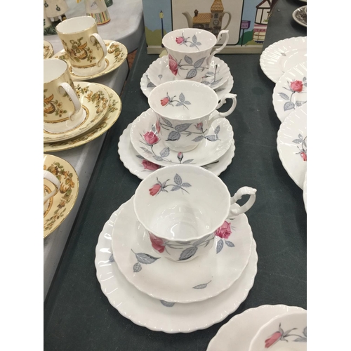 215 - A QUANTITY OF ROYAL ALBERT 'TRENTSIDE ROSE' CHINA TO INCLUDE A SERVING PLATE, DINNER PLATES, SIDE PL... 