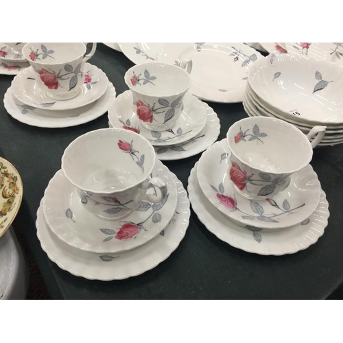 215 - A QUANTITY OF ROYAL ALBERT 'TRENTSIDE ROSE' CHINA TO INCLUDE A SERVING PLATE, DINNER PLATES, SIDE PL... 