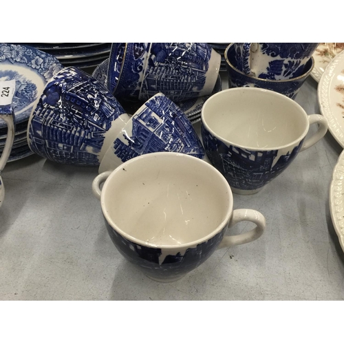 224 - A LARGE QUANTITY OF BLUE AND WHITE PLATES, BOWLS, CUPS AND SAUCERS IN 'WILLOW' AND 'LIBERTY BLUE'