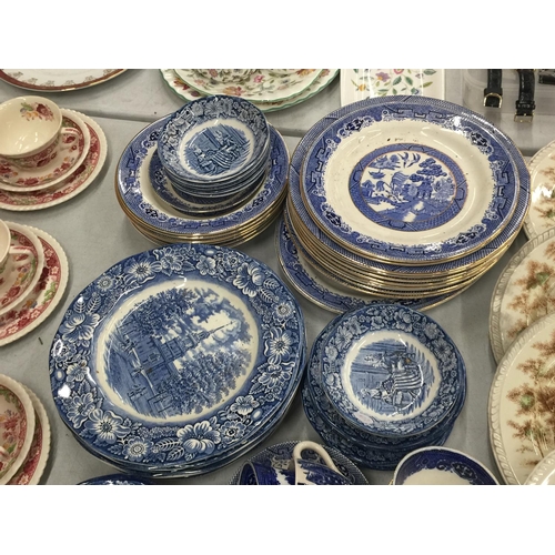 224 - A LARGE QUANTITY OF BLUE AND WHITE PLATES, BOWLS, CUPS AND SAUCERS IN 'WILLOW' AND 'LIBERTY BLUE'