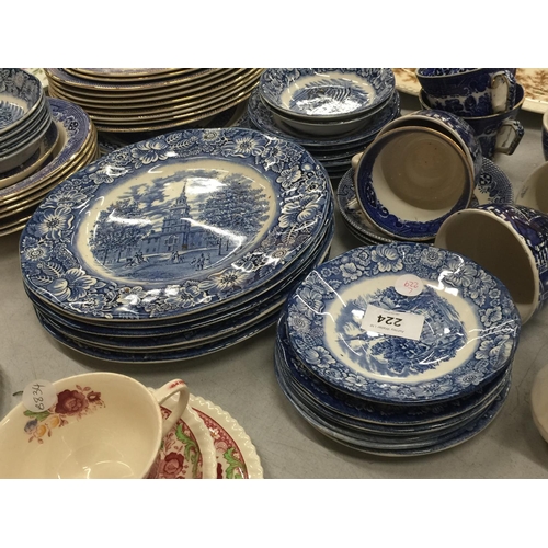 224 - A LARGE QUANTITY OF BLUE AND WHITE PLATES, BOWLS, CUPS AND SAUCERS IN 'WILLOW' AND 'LIBERTY BLUE'