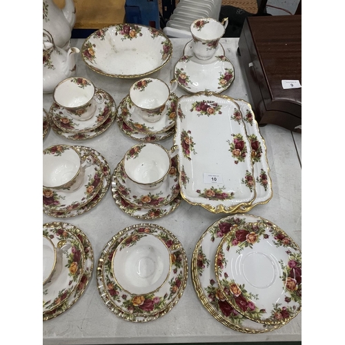 10 - A LARGE COLLECTION OF ROYAL ALBERT OLD COUNTRY ROSES TO INCLUDE TRIOS, CAKE PLATE, SANDWICH PLATES E... 