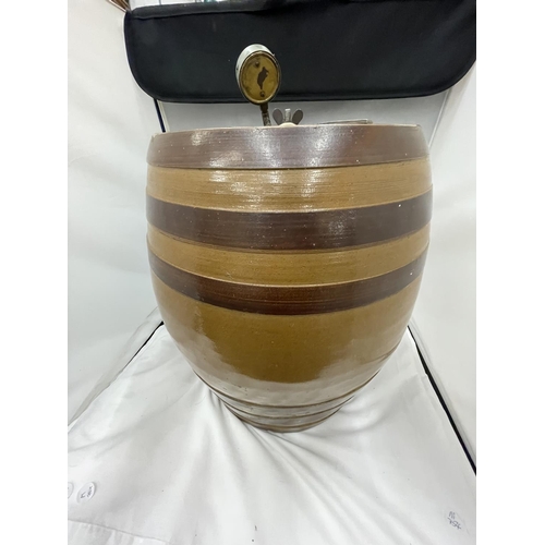14 - A LARGE STONEWARE BARREL WITH A WOODEN TAP AND A BOC GAUGE HEIGHT