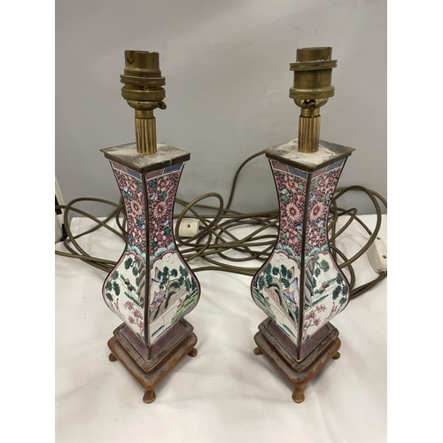 23 - A PAIR OF UNUSUAL SHAPED ORIENTAL LAMPS PORCELAIN AND BRASS ON WOODEN BASE