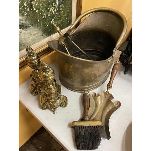42 - VARIOUS BRASS ITEMS TO INCLUDE A LARGE COAL BUCKET, UNUSUAL SHOVEL, BRUSH, TONGS AND FIRE DOGS