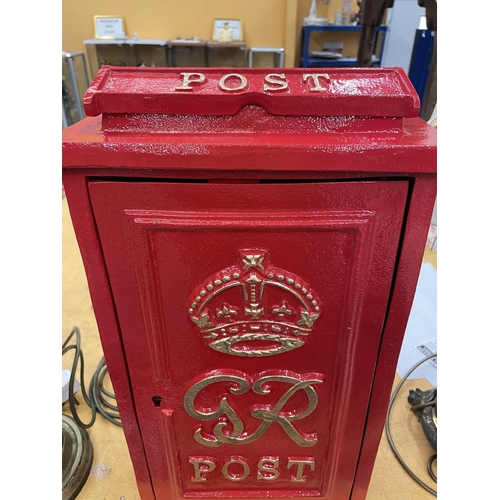 56 - A RED WALL MOUNTED GR POST BOX WITH KEYS