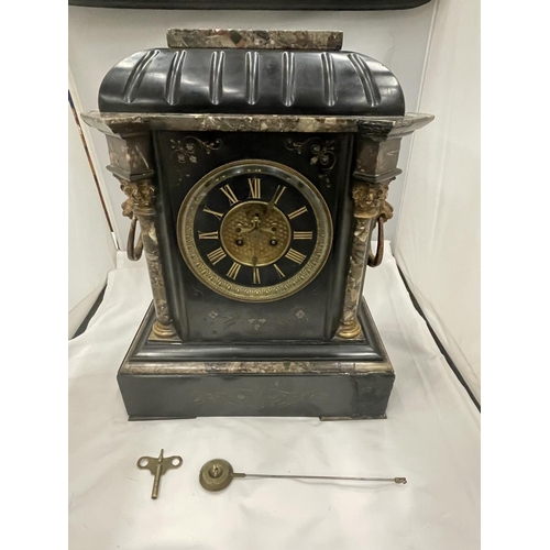 6 - A HEAVY SLATE AND MARBLE MANTLE CLOCK WITH ENGRAVED FLOWER DECORATION AND LION HANDLES TO THE SIDE S... 