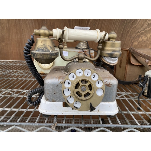 1240 - A VINTAGE METAL DIAL TELEPHONE WITH BRASS EAR AND MOUTH PIECE