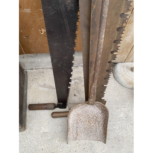 1287 - THREE VINTAGE CROSS CUT SAWS AND A VINTAGE CAST IRON DOUGH SHOVEL