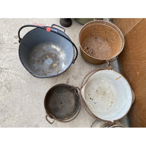 1293 - FOUR VARIOUS CAST IRON COOKING POTS