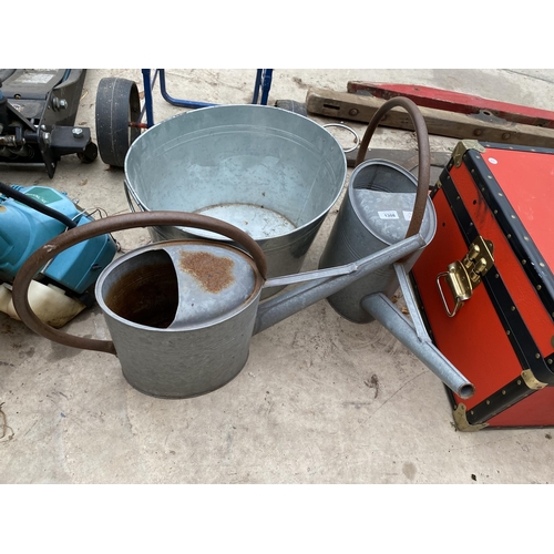 1308 - TWO GALVANISED WATERING CANS AND AN ICE BUCKET